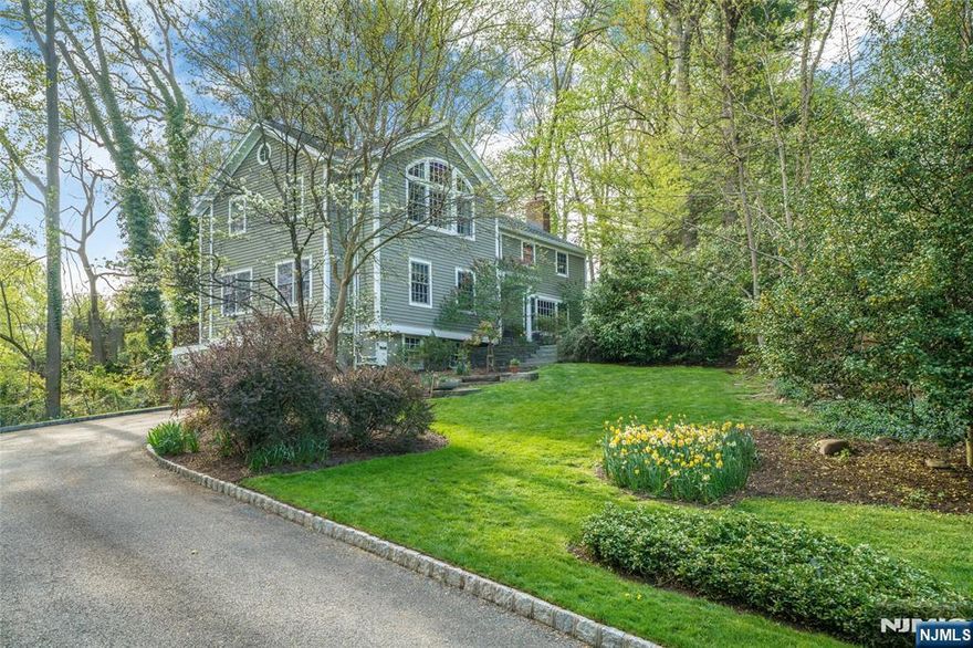 Located on a quiet cul-de-sac in the heart of Short Hills, 27 Inverness Court offers an incredible opportunity to own a beautifully expanded and meticulously maintained home on 0.69 private lush acres. This spacious 4-bedroom, 4 full and 1 half bath residence was thoughtfully renovated in 2002, seamlessly blending timeless charm with modern luxury. The entire first level is open concept, with a stunning kitchen in the heart of the home completely reimagined for the serious chef, featuring a large center island, high-end appliances, abundant cabinetry and a breakfast room filled with sunlight. Nearby, an elegant dining room, spacious gathering areas, first floor bedroom and functional mudroom offer an ideal layout for everyday living and entertaining. Upstairs, all bedrooms are generously sized with large closets while a spectacular primary suite addition offers a true retreat, complete with soaring ceilings, oversized windows, two walk-in closets and a spa-like bath. Outdoor living is just as impressive, with a large deck, covered and open patios, and an expansive backyard framed by mature trees. Additional highlights include a two-car garage with EV charging, flexible lower-level space and a location that cannot be beat, offering easy access to Millburn's highly rated schools, shopping, dining and Midtown Direct trains. Combining space, sophistication and convenience, 27 Inverness Court is the perfect place to call home in one of New Jersey's most sought after communities.