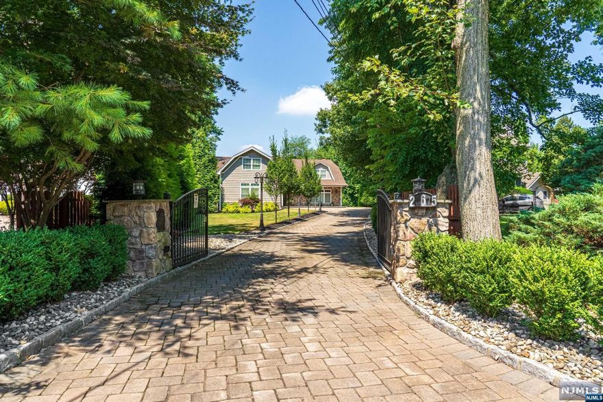 PRESENTED by MICHELE WYSS,(201-321-6733),THE CHEN AGENCY,REALTORS. Welcome to 265 PIERMONT ROAD,a meticulously maintained colonial, on apprx.half-acre. Enter the private, gated paver courtyard to discover 5,000+ sq ft of elegant living space. The 1st floor features a gourmet kitchen with casual dining, dining room, family room, powder room, laundry, and private bedroom with full bath. The oversized living room overlooks a manicured backyard with a covered patio, great for entertaining. Upstairs, the primary suite boasts a 12-ft tray ceiling, sitting area, and luxurious bathroom with double stall shower.Two additional 2nd floor bedrooms share a full bath, with tub and walk in double shower. The customized floorplan includes a private second-floor flex space ideal for a home office and gym. The finished basement offers additional versatile space for a lg media room, and a private bedroom suite. There are many spectacular finishes included in this very special home,a must see!