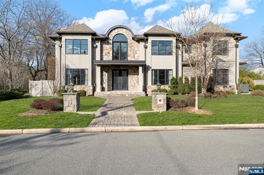 Recently constructed elegant center hall colonial features a dramatic 2 story entry foyer leading to a formal dining room, formal living room, gourmet eat in kitchen includes top of the line appliances, custom cabinetry, butler's pantry & walk in pantry. The kitchen opens to family room with fire place. Radiant heat floors. The first floor also offers 2 powder rooms and access to 3 car attached garage. The second floor offers lavish master suite with sitting area, fire place and generous his and hers closets. The master bathroom offer ultimate spa like retreat!! Also on the second floor 3 ensuites all with generous size rooms, walk in closets and custom cabinetry with full bathrooms, and specious laundry room. The lower level is finished with recreation room, room, and a full bathroom. Other special features include, prep for generator and smart home, central vacuum and more! Located in the North Cliffs. This phenomenal designer combines luxury living with day to day practicalities.