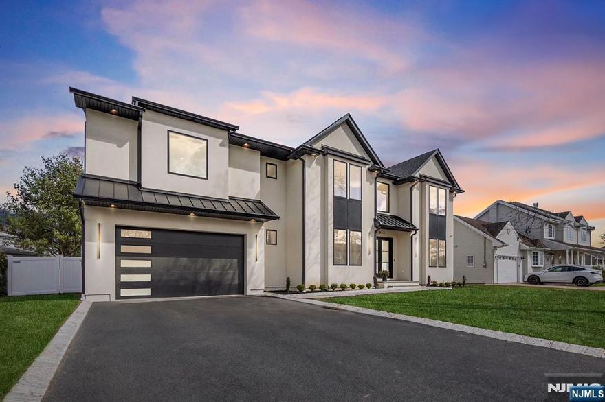 *See VIRTUAL TOUR link for comprehensive video tour, full 3d model, floor plans & more.* Luxurious new construction in the low tax town of Paramus offering 7,700+ total sq ft on an oversized 90 x 121 lot, blending elegant design with top-tier functionality. Features include 10-foot ceilings, custom trim work, and herringbone flooring in the two-story foyer. The main level features a first-floor bedroom suite, a chefâ€™s kitchen with Viking appliances, custom cabinetry, and a layout that opens to a spacious backyard (with room for a pool). Upstairs, the primary suite includes 2 custom walk-in closets and a private balcony. Enjoy upscale finishes throughout, including porcelain floors, floating vanities, and white oak hardwood flooring on both levels. The home is prewired as a full smart home, with hookups for exterior cameras, alarm systems, and customizable automation. Pella windows, a movie theater room, laundry appliances included, hookups for a whole-house generator, & much more!