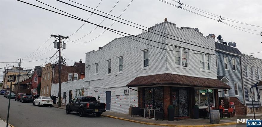 Corner property just behind of shopping mall with Amazon Fresh, Aldi tenants , 2story 4unit mixed use( 2 commercial unit+ 2 apt), 1st floor : one tenant use two units together ( front unit; cafe, rear unit: catering &party), 2nd floor; 2apt (1bed each) , separate gas & heating electricity. The 75% of water bill paid by the cafe