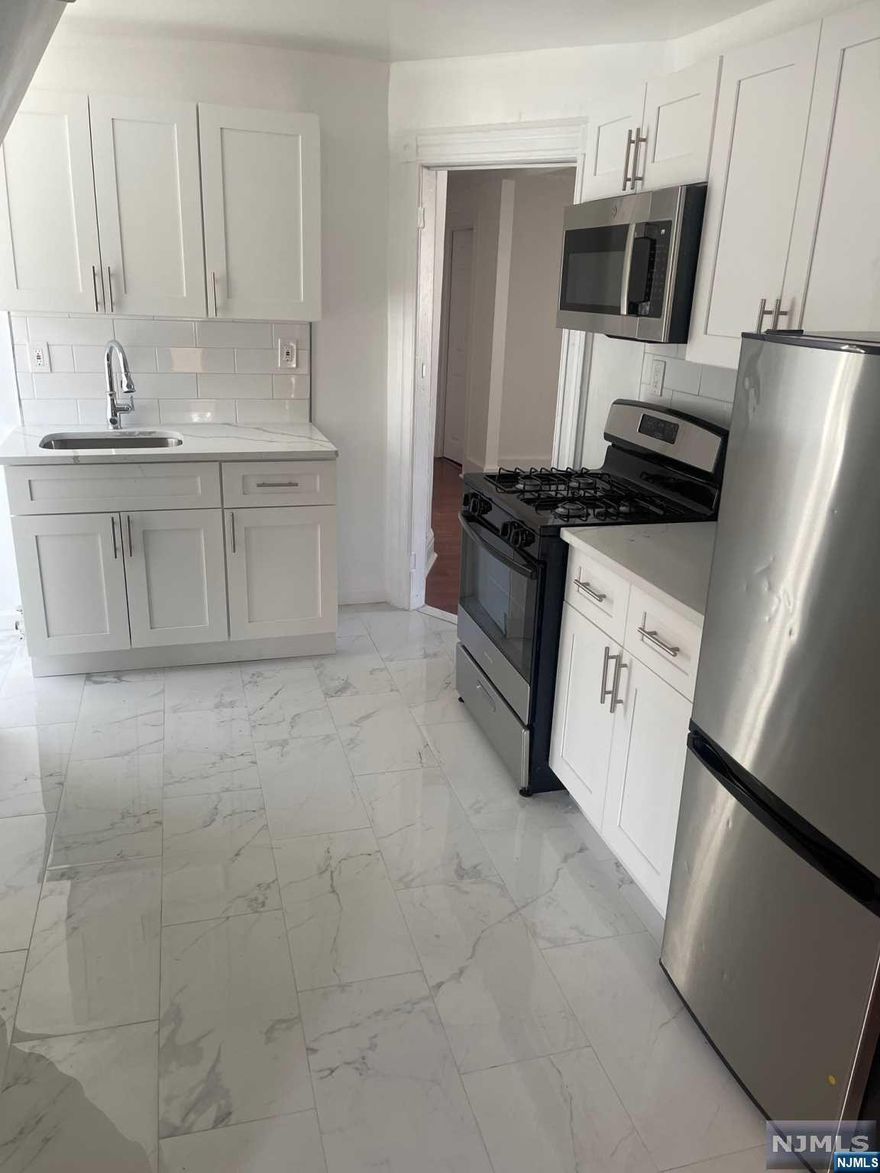 BACK ON THE MARKET BUYER couldn't perform.!Live in one unit and collect rent from the other units. Perfect investment for owner occupant or for investment. 1st floor features 3 bedrooms in which tenant is using one for a family room, 2nd floor unit which has 3 bedrooms with one having a walk-in closet. 3rd fl unit has 2 bedrooms with additional space that can be used for storage or an office. A semi--finished basement has potential for additional storage or laundry hook-up