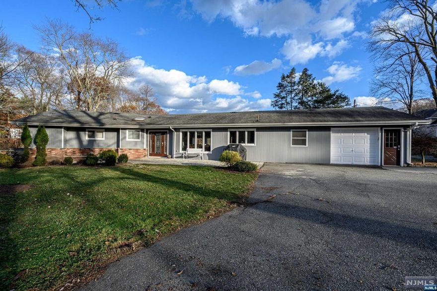 Stunning Ranch home on a 3.75 acre lot with Pond, Stream & gorgeous water views! Beautifully updated, this home features a light and bright, freshly painted open layout with large room sizes, gleaming tile flooring & plenty of natural light all through, with French sliders and peaceful nature views from every room! Light & bright Great Rm is the heart of the home, featuring a flr to ceiling stone Fireplace, soaring raised ceiling with skylights & 4 French sliders with panoramic views of the property. Updated Eat-in-Kitchen offers SS Appl., updated counters & breakfast bar that opens to the Dining area. Each Bedroom is generous in size, inc one with it's own Kitchenette & Full Bath, great for an IL Suite! 2nd Suite has it's own WIC & private bath with soaking tub. Enjoy sunrises from every Bedroom & Great Rm! Outdoor space is perfect to enjoy all that nature has to offer- stocked Pond, Dock w/Paddle+ Mini Boat, Hot Tub, Patio, Barn & plenty of extra space.