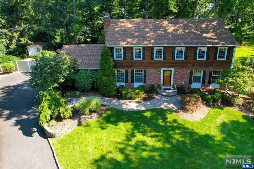 You have arrived home! Meticulously maintained and updated 5 BEDROOM COLONIAL with wonderful curb appeal and a beautiful private backyard oasis including a SALTWATER INGROUND POOL offers an entertainer's delight. The Entry Foyer leads to a large Living Room and Family Room with a wood burning FPL. The updated Eat-In Kitchen has granite counters, stainless steel appliances and a breakfast nook with a view of the outdoor setting. The Dining Room flows into a 4 season Sunroom with access to the backyard area. A Laundry Room completes the first floor. Upstairs you will find 5 Bedrooms. The large primary BDRM has a walk-in closet and renovated Full Bathroom. Four generous sized BDRMS and Full updated Bathroom complete the second floor. The Basement has a finished Recreation Area plus Utility and Storage Rooms. HW floors, 2 car garage EV ready, and many updates including a NEW ROOF in 2022! Very close to Downtown and train station. Excellent Schools. This pristine home has it all.