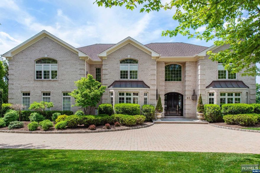 This sprawling North Caldwell estate is truly next-level luxury. No expense was spared in the construction, design or maintenance of this single-owner home. Everything top of the line. Gourmet kitchen, butler's pantry, billiard room, soundproof multi-level theatre, gym, solarium, large Brazilian Hardwood deck, 2 wet bars, 3 fireplaces, whole-house generator, a great room with majestic views of the mountains and rear grounds, a master suite that keeps on going - the list of amenities and quality of materials simply has to be experienced. There's also an easy, comfortable flow inside and out that is just perfect for entertaining. The lower level exits into a private oasis on 3 levels. Custom heated pool, covered patio, uncovered patio, separate sitting area, outdoor kitchen - and that's just the first level. Gorgeous custom fire pit seating area on the level below and a large play area below that. Top-rated schools and a vibrant community, North Caldwell is only 19 miles from NYC.