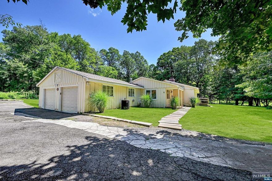 A charming Ranch nestled away from the road in an extremely private property setting. A rare opportunity to own in a great town and much desired school system. Please note house is being sold strictly "AS IS". Come see for yourself, bring your imagination and make this your forever home.