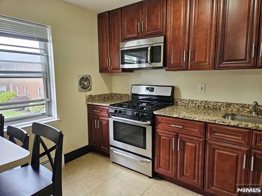 AMAZING RENTAL OPPORTUNITY! RENOVATED FIRST FLOOR CONDO WITH ONE CAR GARAGE (additional fee) AND EXTRA PARKING SPACE. BRIGHT AND OPEN WITH HARDWOOD FLOORS THROUGHOUT . KITCHEN WITH STAINLESS STEEL APPLIANCES AND GRANITE COUNTER-TOPS. FANTASTIC LOCATION IN THE CENTER OF TOWN CLOSE TO SHOPPING, SCHOOLS AND RESTAURANTS. BUS TO THE CITY JUST STEPS AWAY. GREAT COMPLEX WITH OUTDOOR IN-GROUND POOL! HEAT AND WATER INCLUDED. TENANT RESPONSIBLE ONLY FOR ELECTRIC. Apartment is freshly painted.