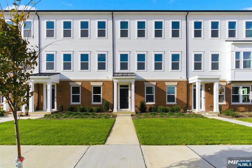 Gorgeous New Construction Townhome in Desirable Parker's Creek Community! Spacious 4-bed, 3.5-bath, 2 car garage townhome featuring an elegant open-concept layout and designer finishes throughout. The gourmet kitchen is a showstopper, a large center island, walk-in pantry, and premium KitchenAid appliances, seamlessly flowing into a bright dining and living area and a private balcony with beautiful sunset views. The entry level welcomes you with a spacious foyer and a guest suite with full bath, while the top floor offers three bedrooms, including a serene primary suite with walk-in closet and private bath. Enjoy 9-foot ceilings, hardwood floors, custom tile work, and a convenient laundry center on the upper level. An oversized 2+ car garage and plenty of storage. Ideally located in Parker's Creek, this home offers top-rated schools, a peaceful setting, and easy access to shopping, dining, NYC transportation, and the Jersey Shore. Ideal for professionals relocating families entering the Oceanport school system or anyone seeking easy upscale living near the shore.