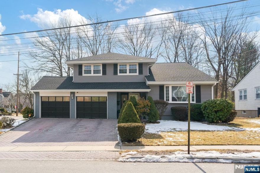 Step into elegance with this 4-bed, 2.5-bath split-level stunner, seconds from Downtown Westwoodâ€™s charm. A granite-clad foyer welcomes you to a cozy family room with backyard access, a bedroom, half bath, and laundry. Upstairs, an open living-dining area with gleaming hardwood flows into a modern eat-in kitchenâ€”newly upgraded for culinary bliss. The spacious master suite boasts a private bath, joined by two generous bedrooms and another full bath. Brand new roof, and kitchen make it move-in ready. Nestled in a prime spot near shops and schools, this home blends style and convenience. Your dream retreat awaitsâ€”act fast!