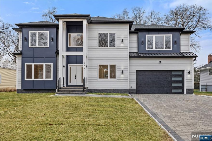 Approx 4000 sq ft East facing new construction home over small portion of original foundation- 5 master bedrooms suites!- each suite with private bath & walk in closet and closet organizers! Principal bedroom has tray ceiling, dual walk-in closet, double head shower and tub! 6 1/2 baths in total. Main level has 9' ceilings and spacious open concept Living room with electric fireplace perfect for daily living and entertaining, formal dining room, 1 bedroom/office with a full bathroom and a half bathroom. Gorgeous kitchen with island & quartz tops with stainless appliances. Finished basement with recreation room and full bath. 2 car built in garage with 2 outlets adequate for EV chargers! Ample parking on paverstone driveway. Hardwood floors, tiled baths, 2 separate gas HVAC heating and cooling systems, 200 amp electric. Private fenced in yard with new sod. This prestigious home is located in a wonderful neighborhood, close to NYC transportation. River Edge offers TOP-rated schools.