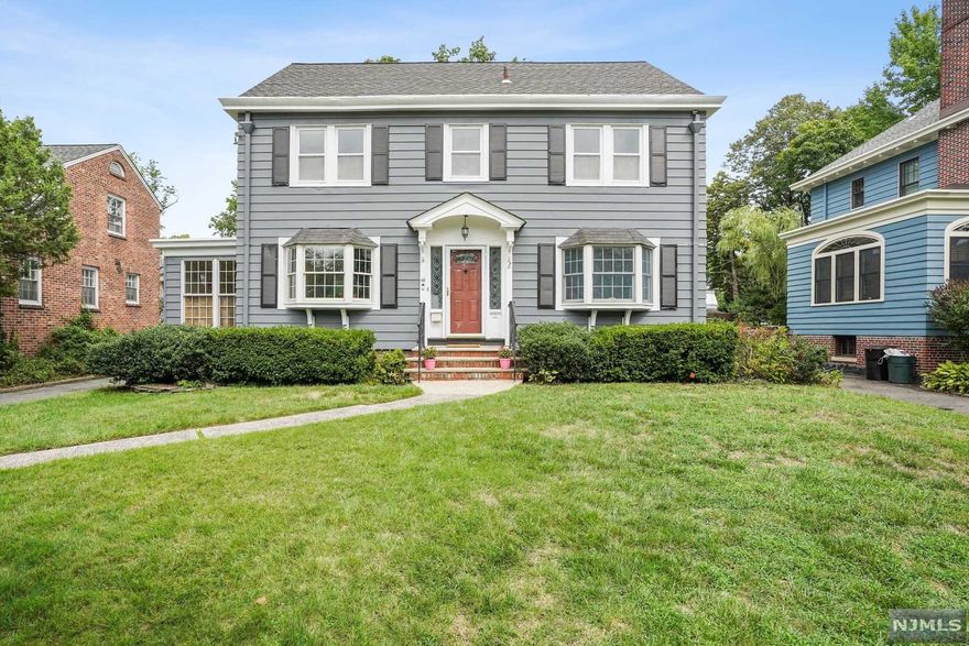 Be charmed by this center hall Colonial w/serious curb appeal in historic Montrose Park. With HW floors & 2-zone CA, this freshly painted 4BD/2.5 BA home offers space to entertain. On the 1st fl, you'll find a large LR with a FP, tray ceiling & recessed lighting, a gracious DR w/ chair rails, a light-filled sunroom & 1/2 bath. There are bay windows in the kitchen, LR & DR. The kitchen boasts SS appls & lots of cabinets. There's a mudroom off the deck & French doors leading to the deck which spans the width of the house. On the 2nd fl, you'll find the ensuite primary BD w/a bath with shower & clawfoot tub, a large WIC + 2 more closets, as well as 2 more comfy BDs & a hall BA. The bathrooms have heated tile floors, as do the kitchen & mudroom. Upstairs is the finished attic, w/a loft area for an office/playroom & 1 addtl BD. The 3/4 finished LL has a RR, Laundry Rm & storage. The lovely backyard is perfect for outdoor entertaining & there's a 2-car oversize garage. Great location!