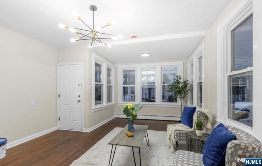 Welcome to this beautifully renovated first floor apartment, thoughtfully updated with a modern vision. This home features two bedrooms, a large and inviting living room, dining room and eat-in kitchen perfect for everyday living and entertaining. Renovations are fully up to date, offering a fresh and contemporary feel throughout. Pets are welcome.