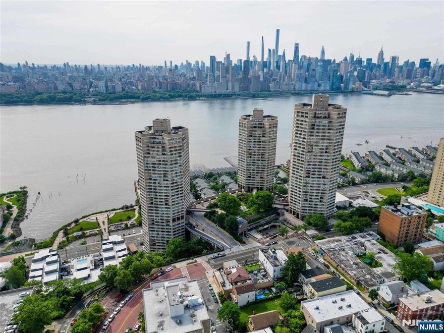 Welcome home to this tastefully upgraded 1337sf apt in luxury Galaxy Towers. High floor spacious apt with NYC/ Hudson river views & a sunny southern exposure. Marble floors with a pass-thru kitchen with ss appliances and countertops, lots of closets. Laundry on fl. Maint includes all utilities (h, hw, gas, elect, ac, w, etc...) and all amenities, enjoy: indoor pool, outdoor pool, state of the art gym, tennis courts, concierge, drm, security, and more. Indoor parking available for an additional cost. Bus at doorstep 24/7 with 20min to midtown. Convenience store and professional offices just one elevator ride away. Close to Gwb, Lincoln tunnel, and major highways. Parks and shops few minutes away.
