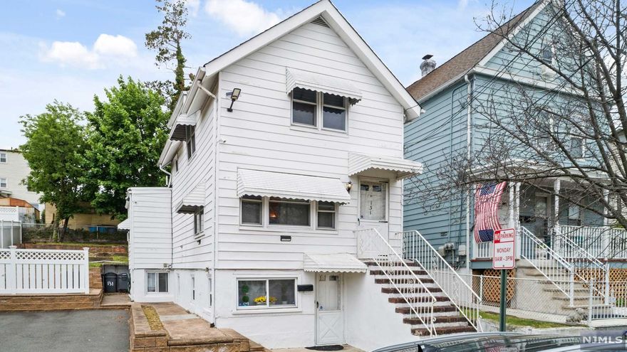 *TIRED OF BIDDING WARS!?* Us too! That's why this home is APPRAISED! This charming Colonial is in move-in condition; new furnace installed approx. 2019 & new roof installed in 2013. Separate entrances to ground flr & 1st flr for your convenience. 4-car driveway & large paver patio is perfect for entertaining. The kitchen boasts lots of counter space. Family rm berber carpeting & recessed lighting offer a warm & elegant feel. Large laundry rm w/utilities & plenty of storage another win! Pristine condition hardwood flrs throughout the home. 2nd flr hallway includes a very spacious walk-in closet w/more storage. Large enclosed porch in the back is another bonus w/endless options. This property is only 2 blocks from the NY City bus stop, 1 mile from NJ Transit Train Station, walking distance to elementary school, library, park & shopping. Current appraisal supports value over asking price* Present all offers w/pre-approval or proof of funds. *Schedule your appointment NOW!*