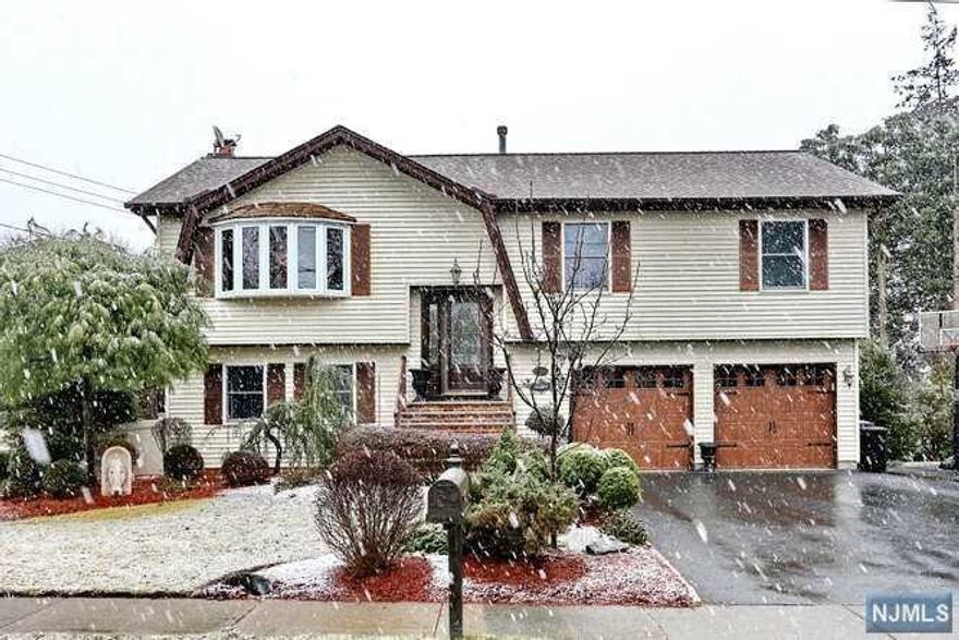 Welcome to this meticulously maintained 4 bed 2.5 bath contemporary bi-level which will more than satisfy your every want & need including a vacation paradise in your own backyard! Inside featuring cathedral ceilings, updated kitchen & bathrooms, HWFLs in Livingrm & Dining, travertine tiled Family room w/ fireplace, alarm system & newer sliders on both levels leading to your amazing fenced in property! Outdoor featuring 2 tiered TREX decking, Heated pool w/ newer liner & surround sound speaker system, outdoor kitchen, TV & ceiling fan, new paver patio & fire pit, 6 zone sprinkler system, mature privacy trees & landscape lighting, green space, roof (8 yrs old), new garage doors,shed, security cameras, plus portable home generator included. Beat the heat (and gas prices!) all summer while entertaining & relaxing in this PARADISE! You'll never want to leave! River Vale is consecutively NJ #1 safest town(safewise.com).Near Top Schools, Parks, shopping & trans. TRULY AN AMAZING HOME!!