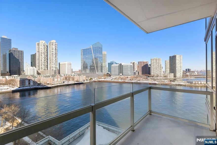 Incredible 2 bed/2.5 bath 1473sqft corner home with stunning NYC/river views and a private balcony in the desirable community of Crystal Point. The chefâ€™s kitchen features Pedini cabinets with glass accents, granite countertops, tiled backsplash, stainless steel appliances, and a spacious island. The open living space provides views of NYC, the Hudson River, and breathtaking sunsets through floor to ceiling windows, as well as your very own private balcony. The primary bedroom has a walk-in closet and spa-like ensuite bathroom. The second bedroom is large with another walk-in closet. The home also includes hardwood floors, central AC, an in-unit washer/dryer, half bath, and 1 car valet parking. The buildingâ€™s luxury amenities include 24/7 concierge, gym, swimming pool, sauna, steam, outdoor & indoor jacuzzi, playroom, theater, and outdoor barbecue area. Conveniently located near Path, Ferry, Light Rail, and shopping.