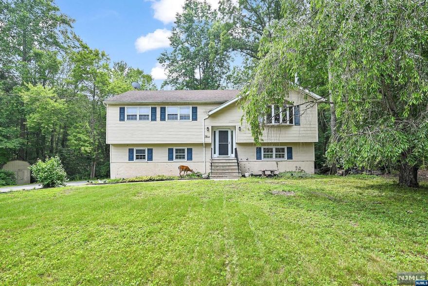 A Great Opportunity To Own This 3 Bedroom 2.5 Bath Bi-Level Home Located in Desirable Mt Laurel Community! The Living Room w/Bay Window has a Fireplace and Separate Dining Area! The Updated Kitchen has Plenty of Storage, a Center Island and Stainless Steel Appliances! 3 Nice Sized Bedrooms, the Master Bedroom also has a Full Updated Master Bath with Stall Walk-In Shower! The Finished Lower has an Updated Half Bath and The Family Room Has New Carpeting with Double Patio Sliders Allowing for Lots of Natural Lighting and Access to a Level Back Yard! The Lower Level also offers Garage Access, and a Work Shop Room! New Utilities HWH, Furnace and Oil Tank! This Home is Part of Both Upper Greenwood Lake and Mt Laurel Lake! Enjoy the Best of Both! Located Walking Distance to Playground, Sports Field, Skate Park and Private Mt Laurel Beach. UGL also offers Members Only Beach and Clubhouse, as well as Boating and Fishing! Close To Drive-In Movie Theatre,Orchards,Wineries,Golf,Skiing & More!