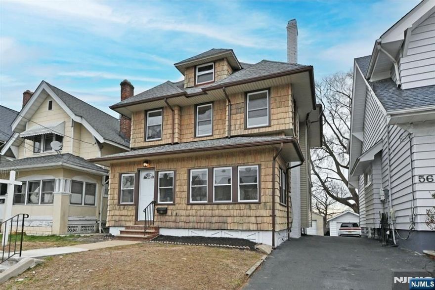 Beautiful large and remodeled colonial with many updates such as brand new windows(except 3), brand new kitchen w/ new appliances and baths, brand new 3/4 in oak hardwood flooring, new steps and so much more!!! First floor offers a beautiful open porch for those beautiful days and nights, Beautiful large entry foyer, open living room and a formal dining room with gorgeous ceiling, additional back room poss office or workout room, beautiful new kitchen w breakfast counter open to dining room/glass backsplash/quartz counters and pantry w slide out drawers and new s/s appliances, new powder room and a rear mud room to yard!! Second floor beautiful bright primary bedroom with window seats,2 additional bedrooms, new bath and walk up stairs to large attic with 2 more potential bedrooms!!! Basement full partially finished & freshly painted with yard access, multi purp rm, laundry & utility room....nice size yard and 1 car detached garage with painted floor and new door/roof and window!! Nothing to do but move in and walking distance to school,shopping,parks and transportation!!!! Will not Last !!!