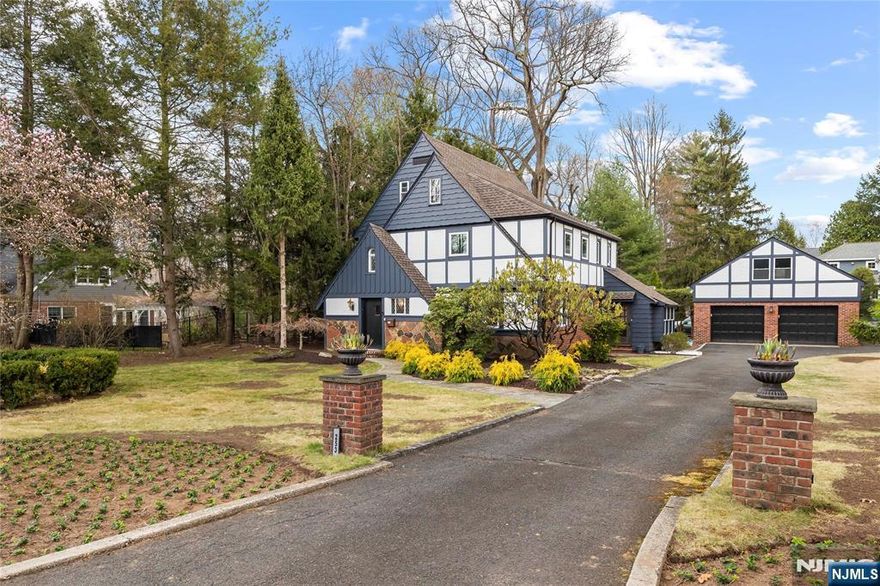 Fall in love with this stunning Tudor Colonial in Haworth, NJ ranked the #1 place to raise a family (Niche.com, 2025). This 4 bed, 2.5 bath home blends charm with modern updates. A sun-filled foyer leads to a bright living room, dining area, and eat-in kitchen with stainless steel appliances. The second floor features a primary suite with an updated bath, two additional bedrooms, and a full bath. A spacious third-floor bedroom can serve as an office. Nestled on a treelined street, just 1.5 blocks from the K-8 school, this home sits on a 1/2 acre corner lot with a patio, fire pit, and oversized 2 car garage with loft. Recent updates include Pella windows and central air. Donâ€™t miss this gem!