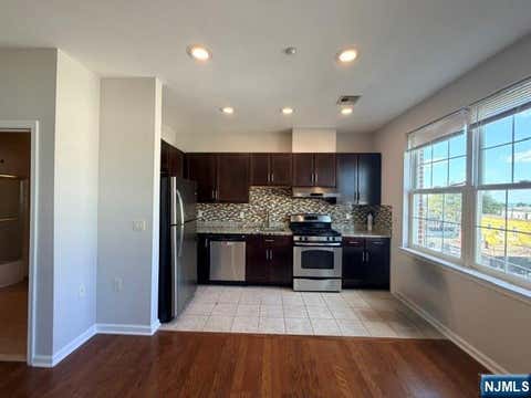 Photo of 1209 Summit AVE #405, Jersey City, NJ 07307 (MLS # 26031307)