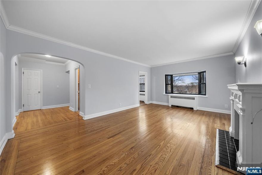 * Presented by Wendy Gamez 917-504-3347 * Welcome to Chester Tracey Garden Apartments, ideally situated in the prime East Hill of Englewood. This 1st-floor updated 1-bed/1-bath residence is tucked away in a quiet, garden-lined setting, offering both charm and convenience. The unit features refinished hardwood floors, a renovated full bath, a cozy decorative fireplace, and a fully equipped kitchen with newer appliances. Freshly painted throughout, this apartment is bright and move-in ready. Heat, hot water, water, and one assigned outdoor parking space are included in the rent. Tenant is responsible for gas and electricity. Coin-operated laundry is available on-site for added convenience. Located just minutes from Englewood's vibrant downtown, NJ Transit bus service to NYC, parks, dining, and shopping. Tenant is responsible for $125 CCO fee.