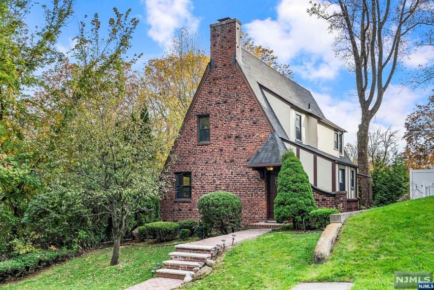 Welcome to this Brick Tudor Home in Tenafly. Passing thru Spacious Entrance Foyer, 1 Fl features Living Room with fire place, Dining Room, Updated Kitchen, and Powder Room. 3 bedrooms & Bathroom are on 2nd Fl. Ground Level is finished with a large room, full bath, laundry room, and access to garage & backyard. Hardwood Floor throughout. Ductless A/C installed in every bedroom, living room, and dining room. 1 car garage with ample parking spaces on driveway. The whole house is newly painted. New furnace was installed 2 years ago. Favorable Blue Ribbon Schools in Town.