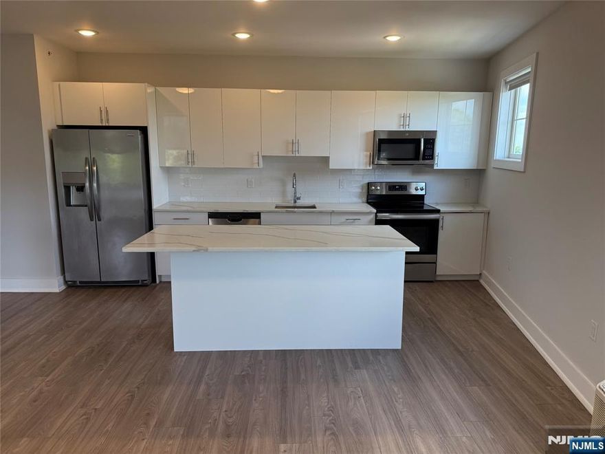 **FIRST MONTH FREE on a 13-month lease + one parking space included! - for occupancy commencing on or before 2/1/26!** Welcome to The Addison - Fort Lee's new luxury rental building offering a variety of upscale, spacious floor-plans. The Addison offers high-end residences fully equipped w/ modern kitchens w/ stainless steel appliances, quartz countertops, full islands & tiled backsplashes, open living/dining areas, shades on all windows, modern bathrooms & a full-sized washer & dryer in each unit. Exclusive 24/7 virtual doorman service for communications, package deliveries & access control via video intercom system linked to your smart phone. The Addison includes a large on-site fitness center including virtual touchscreen workout mirror, electric car charging stations & parking garage w/ direct elevator access to all residences for uncompromising security. Pet friendly - (25 lb limit) $500 pet fee + pet rent per month! Tenants pay ALL utilities! All amenities INCLUDED in the rent! PARKING: 1st space INCLUDED IN THE RENT(!); Additional space - $125/monthly! Virtual tour available upon request!