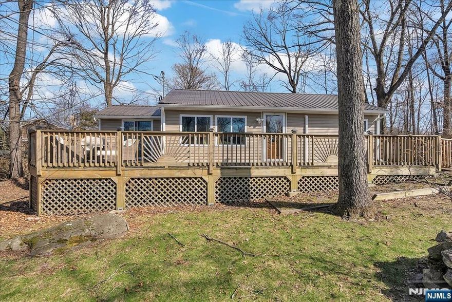 Welcome to this charming lake-style ranch nestled in the sought-after Highland Lakes community. This beautifully maintained home features 2 bedrooms and 1 full bathroom, offering a perfect blend of comfort and simplicity. Renovated in 2021, the home showcases an updated kitchen and a newer roof, along with timeless hardwood flooring that flows seamlessly throughout the space. The thoughtful improvements create a move-in ready experience, ideal for both year-round living or a relaxing getaway retreat. Enjoy all that Highland Lakes has to offer, including access to five pristine lakes and seven scenic beaches. The vibrant community also features a clubhouse, multiple playgrounds, pickleball and tennis courts, as well as basketball courts, perfect for an active and outdoor lifestyle. Beyond the neighborhood, you'll find a variety of nearby attractions such as premier golf courses, a popular waterpark and ski resort, charming downtown shops and dining, a classic drive-in movie theater, as well as local wineries and orchards. Don't miss this incredible opportunity to own a true Highland Lakes gem, where comfort, recreation, and natural beauty come together.