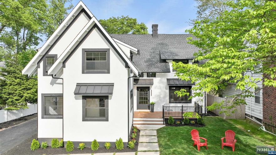 Welcome to 7 Fairmount Ave, a hidden gem nestled in Upper Montclair, just steps away from Brookdale Park and NYC transportation! This stunning Tudor home has been beautifully renovated, offering a perfect blend of modern luxury and classic charm. Prepare to be captivated by the meticulously designed interior, boasting high ceilings, European Spanish tiles, and custom closets throughout. Indulge in a spa-like experience in the primary bathroom, complete with radiant floors, European vanities, luxury light fixtures, and WiFi speakers. The living room is enhanced by a gas fireplace, providing both warmth and ambiance. With new plumbing, electrical, and 2-zone central air/heat, your comfort is guaranteed year-round. Every detail has been thoughtfully chosen to create a contemporary atmosphere while preserving the home's original character.