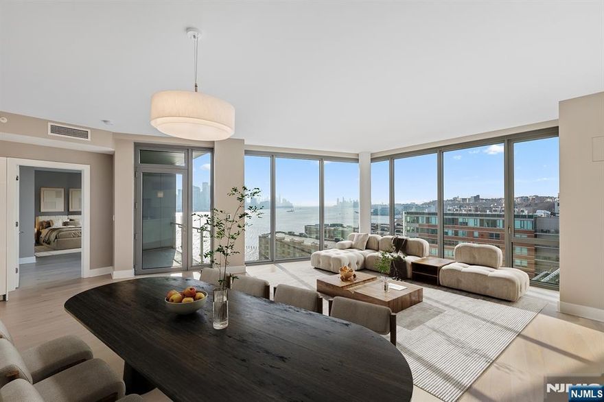 Welcome to Nine on the Hudson. Penthouse 8 is a brand new incredible home with stunning direct east views of the Hudson River and NYC skyline. This luxurious 2 bedroom + Den, 2 bathroom 1,700+ sq. ft. residence has all high end finishes complete with floor to ceiling windows, balcony with views of NYC, beautiful hardwood flooring throughout and a stunning state-of-the-art kitchen, including Bosch appliances and Thermador refrigerator. Separate wet bar area off the living room with wine refrigerator is perfect for entertaining. Two full marble bathrooms contain Kohler fixtures and Restoration Hardware lighting. Bosch washer/dryer in unit. Amenities: doorman/concierge, business center, 2-story gym, sauna, playroom, resident lounge, golf simulator, party room, outdoor courtyard with BBQ and beautiful infinity pool. Complimentary shuttle to the Port Imperial Ferry. Unit includes 2 parking spots and 1 storage unit. Not to be missed!