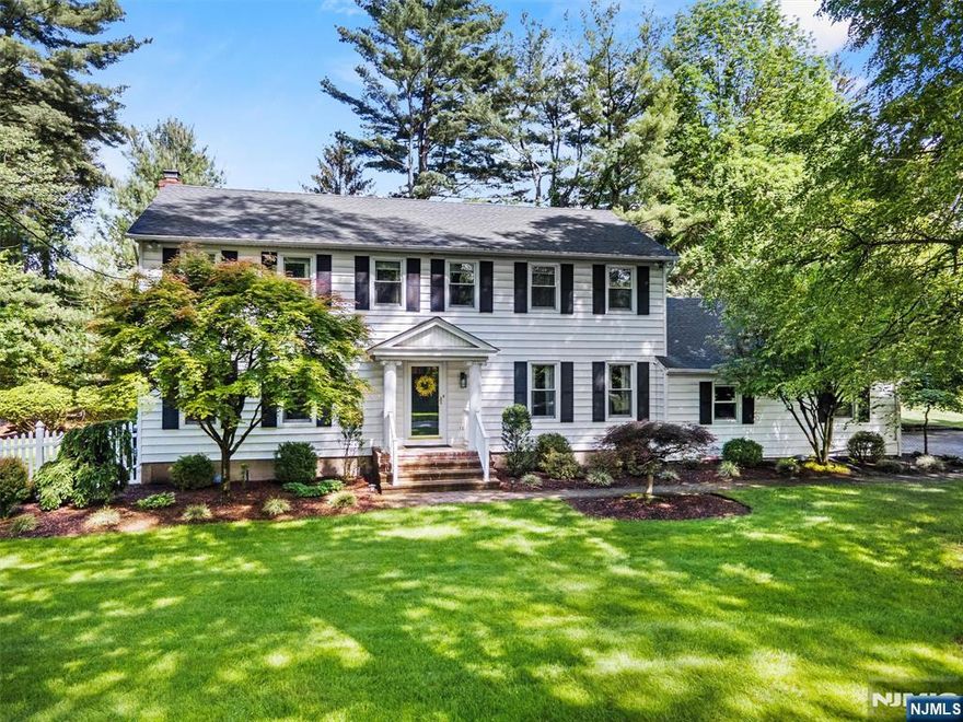 On one of the most coveted streets in town, this rare gem invites you to simply move in and enjoy. Stunning curb appeal welcomes you into a gracious living room with timeless moldings, elegant dining room, and a warm family room with beamed ceilings and fireplace. The chefâ€™s kitchen with custom cabinetry and stainless appliances opens to a showstopping 3-season porch with gas fireplace perfect for cozy nights or summer gatherings. A mudroom and laundry add everyday ease. Upstairs, retreat to a serene primary suite with a full primary bathroom, plus 3 spacious bedrooms and an updated hall bathroom with spa tub. The finished lower level offers space for play, fitness, or a quiet office. Outdoors, entertain on the paver patio with gas hookup or relax in the massive fenced yard. With hardwood floors, a spacious walk up attic, in-ground sprinklers and a newer roof, this home blends comfort, style, and community, an opportunity that rarely comes along in this neighborhood. WANT MORE INFO? CONTACT LISTING AGENT NICOLE MINETTI @ 201-388-0077/nicole@minettidennisgroup.com