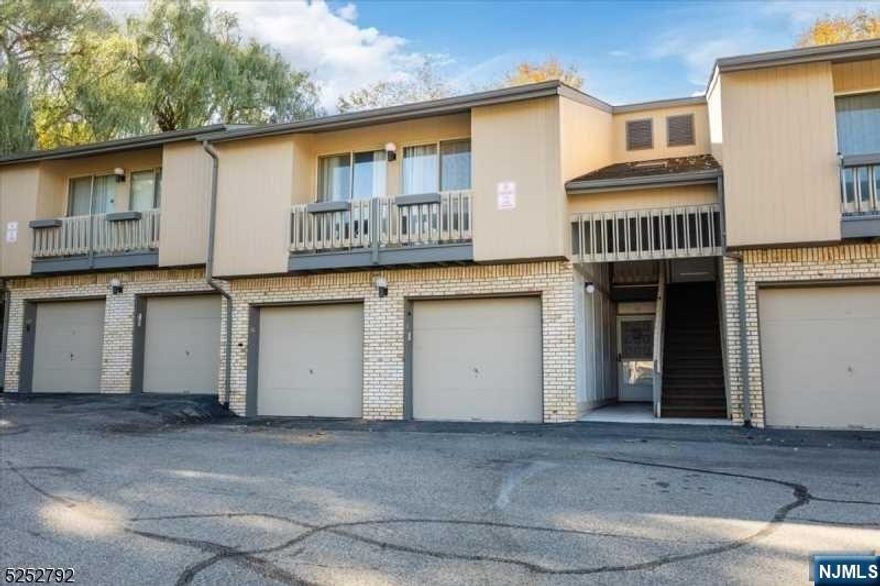 This first floor unit in the desirable Scenic Hill Developement is perfect for a buyer willing to do the upgrades. First floor entrance through the front door or the garage. Spacious LR with a gas fireplace. Formal dining room with space for a large table and chairs. Sliding doors off the DR lead to a secluded deck. The deck is framed by high walls facing a large rock wall allowing for privancy. Den with sliders to the deck is the perfect office space with tons of natural light. Bedroom large enough for a KIng-sized bed with a full bath and two large closets in master. Laundry area in garange with full washer/dryer. Conveniently located near major highways and transportation to NYC. Plenty of restaurants and shopping options. St Barnabas Medical Center within walking distance. Enjoy the association pool, tennis and pickleball courts, playground and clubhouse with exercise room. This home is a must see!