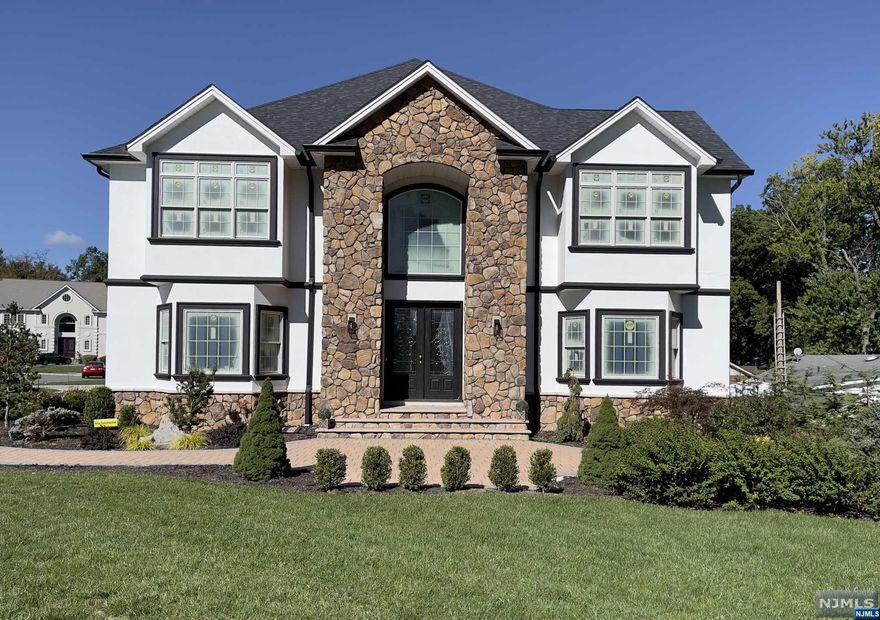 Extraordinary 6 BD, 5 Full BA, 1 Half BA NEW CONSTRUCTION Custom Colonial home built by RODAK HOMES w 8k+ sf of finished living space over 3 floors + attic is complete w high-end finishes including Jeldwen Windows, High Ceilings, Open Floor plan, paver sidewalks, circular driveway, sprinklers & located on a quiet cul-de-sac. Enter into an elegant 2 story foyer w coffered ceiling & sweeping staircase. Entertain in an oversized LR, spacious DR w tray ceiling. Exquisite Kitchen & FR w cozy FP & coffered ceiling. Kitchen w custom cabinets, huge island w quartz, high-end SS appliances, walk-in pantry w entrance to deck & yard. 1st floor ensuite, PR, Laundry, Mudroom w built-ins & separate entrance w access 3 car garage w high lifts. The 2nd floor houses Primary BD w 2 custom closets, Sitting Room, BA w soaking tub, stall shower & dual sinks. 2nd/3rd BD w Jack n Jill BA, 4th BD, Bath & walk-up attic.Enormous completely open Fully finished Basement w tile floor, wet bar & Full Bath