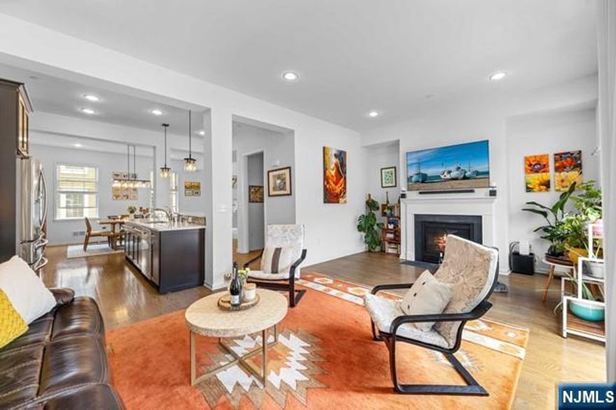 **Call Charmy Morzaria Directly @609.619.2198 for all questions** NorthEast Facing;FINEST & sought after Colonial Style Luxury townhomes in Wright Place Community of Wood Ridge.Beautifully/manicured green lawn, colorfully arched flower walkway welcomes you in.Home includes(NE facing)front & rear entrance w/2car garage, 2 car driveway.1st floor;9ft ceilings, tall windows, 3 closets, junior master bedroom w/full bath. Dramatically arched staircase brings you up to 2nd floor w/10ft ceilings,tall windows,large dining space,modern Kitchen w/breakfast bar,Stainless steel appliances,granite countertops,large living room w/warm & inviting fireplace,pvt.outdoor deck;open concept layout.3rd floor offers master bed w/full bath,his&her closets,2 add'l bedrooms, full bath,laundry room, hardwood floors.Easy & Quick commute:Steps away from WoodRidge Train station & NJ bus(comes every 10 mins,directly goes into Port Authority).