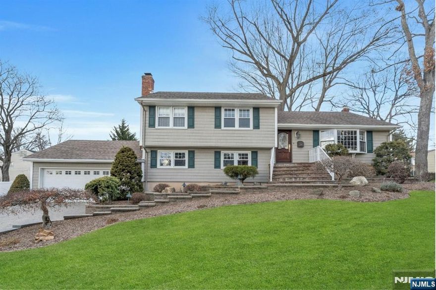 Nestled on a sun-drenched corner lot, this impeccably maintained property is being offered for the first time in over 2 decades. Surrounded by mature, thoughtfully cultivated landscaping, this home is a local favorite admired by neighbors for its beauty & care. Boasting a spacious layout with 3 bdrms, hardwood floors & elegant molding, it offers charm & functionality. The updated kitchen is a chefâ€™s delight, while the expansive hardwood Ipe deck provides the perfect space for outdoor entertaining. The oversized garage & abundant storage add to the appeal. The meticulous treescaping is the envy of the street, reflecting the same attention to detail seen throughout the home. Inside, a stunning brick fireplace in the lower living room creates a warm & inviting atmosphere, & the separate laundry/mud room & study offer added convenience.