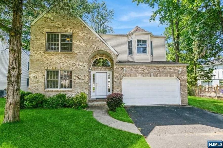 Welcome to this charming home built in 2000 with a new concrete foundation. Step inside to find a spacious entry foyer, formal dining room and living room large family room with fire place . powder room and a two-car garage add to the comfort and convenience. Upstairs, the second floor features three kids' bedrooms and a full bath, The primary bedroom boasts its own ensuite bath and walking closets. The full lower level holds incredible potential and can easily be finished to suit your needs, offering extra living space. Situated on a beautiful, flat property, this home is within walking distance to schools, downtown amenities, and New York City transportation, making it a prime location for convenience and accessibility. Don't miss the chance to make this wonderful home yours!