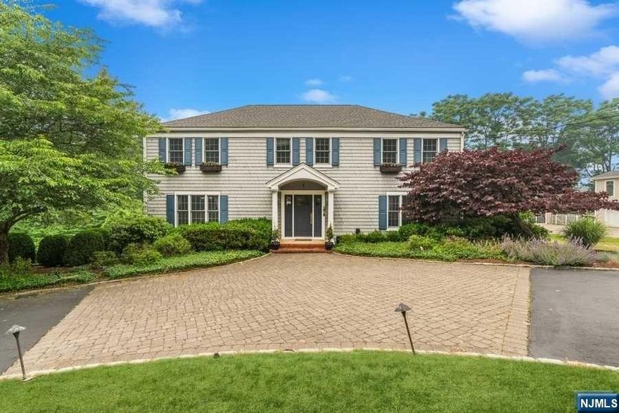 AMERICAN DREAM Center Hall COLONIAL straight out of a Norman Rockwell Scene boasts over 4000 sq ft of Living Space incl. FINISHED WALKOUT Basement! Located in PRESTIGIOUS RIKER HILL on PICTURESQUE BIKEABLE STREET on over .5 Acre of PRIVATE Level Property. A significant 2-StoryADDITION created a 400 sq ft BANQUET Size CHEFS Kitchen with DESIGNER appliances and large Center Island w/Breakfast Bar. Kitchen FLOWS into OPENWARM Family Room w/Gas FIREPLACE & Walk out to 550+ sq ft Deck overlooking LUSH PLAYABLE Backyard. 2nd Level hosts MASTER EN-SUITE with RENOVATED BATH & Walk-in Closet + 3 Additional Bedrooms, Full Bath and Upstairs Laundry. FULL WALKOUT Basement with Rec Room, Bedroom #5 and Full Bath. Close proximity to NYC BUS, SUBURBAN TORAH, Riker Hill School & Playground! Move Right in and Enjoy Life!