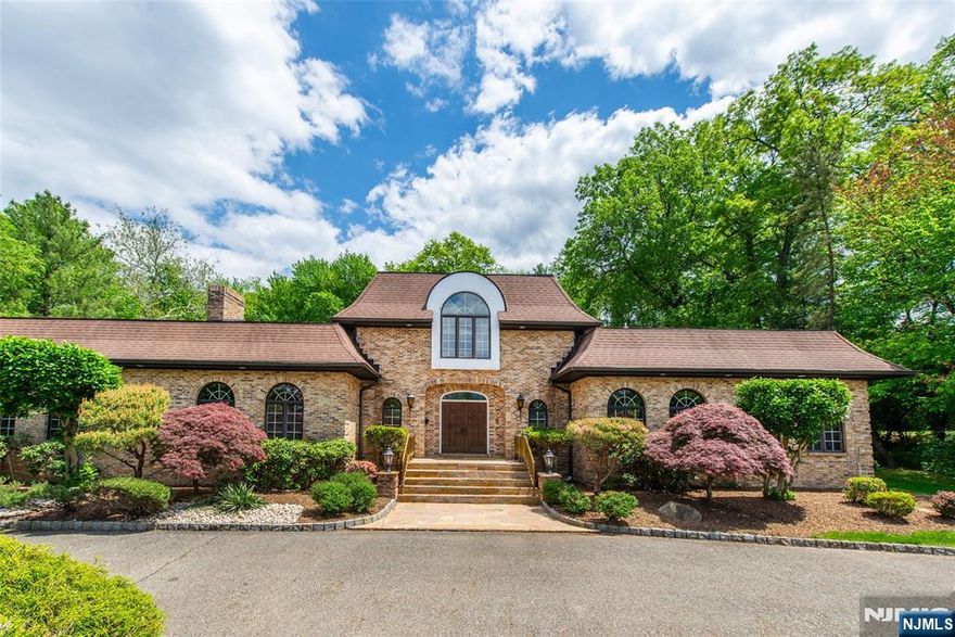 Spacious, expanded custom built brick ranch nestled in the highly sought after Chestnut Hill neighborhood of Livingston. This home features 6BR, 5.1BTH on over 3/4 acre lot. Two story entry way leading into grand LR with gas fireplace. Large DR and oversized kitchen with adjacent laundry room and side door access. Primary bedroom with huge walk in closet, primary bath with seperate tub and shower. Hardwood floors in all first floor bedrooms. Seperate au pair suite with bathroom located on first floor. Private 2nd floor quarters featuring huge walk in closet, seperate office/living room area and private bath. Basement has seperate entrance to garage as well as a wine cellar room. Imagine the possibiliies for a media room, exercise area, recreation area in the unfinished portion of the basement. Finished basement area has high ceilings and recessed lights with seperate bathroom. Perfect for extended living arrangements or work from home. Backyard has a beautiful brick paver patio with wall as lawn area. Conveniently located near schools, shopping & major highways. Chimney/Flue/FP "as is" condition.