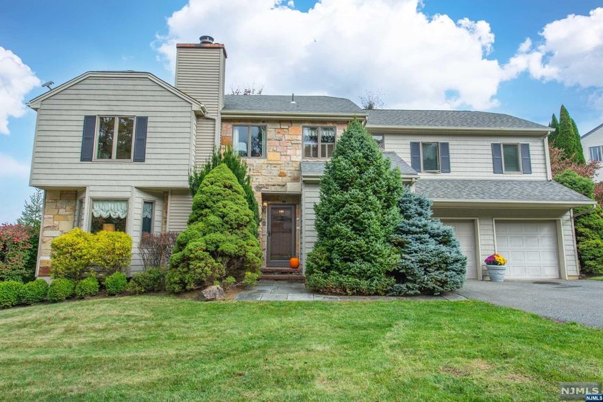 Introducing a spacious and inviting colonial home in desirable Long Valley. This five-bedroom, three full, one half bath gem boasts timeless hardwood floors that extend through most of the home, creating a warm and elegant ambiance. As you enter, natural light pours in from large windows and skylights, illuminating the heart of this home. Gather around the wood-burning fireplace in the living room for cozy evenings. The second floor offers flexibility with an extra room, ideal for a home office or a nursery. Two of the five bedrooms are ensuite, complete with full baths and additional closet space, ensuring comfort and convenience. A first floor laundry room offers additional storage space. The finished basement is perfect for a game or exercise room, offering endless entertainment possibilities. For extra convenience, there's a large two-car attached garage. This home truly offers the ideal blend of classic charm, modern comfort, and plenty of space to make your own dream space.