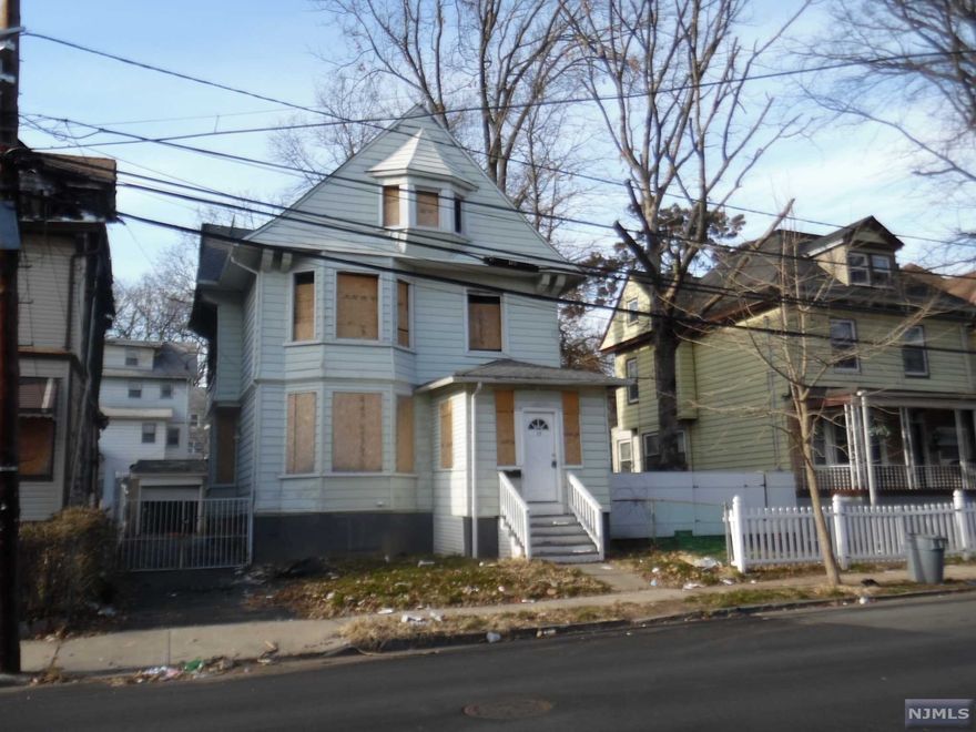 Spacious 4bd 3bath home in need of complete rehab. House is gutted with some fire damage. Forced hot air heating thruout. 1 Car Garage. Cash Offers Only. Buyer responsible for all city inspections/repairs.
