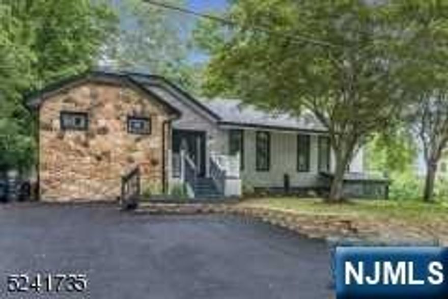 Beautifully renovated raised ranch in the Upper Greenwood Lake section. Step into the main level of the home which offers a formal dining room, living room with high ceilings and wood burning fireplace, kitchen with quartz countertops and brand new stainless steel appliances, 3 season room with heating, 2 spacious bedrooms, and a full bathroom. Downstairs, the ground floor with its own separate entrance offers a large bedroom with a fireplace, wet bar with wine fridge, and a half bathroom. This home featured central AC, brand new roof and siding, BRAND NEW SEPTIC, and a new well pump. Outside the backyard with oversized deck offers lots of space for relaxation or entertainment.