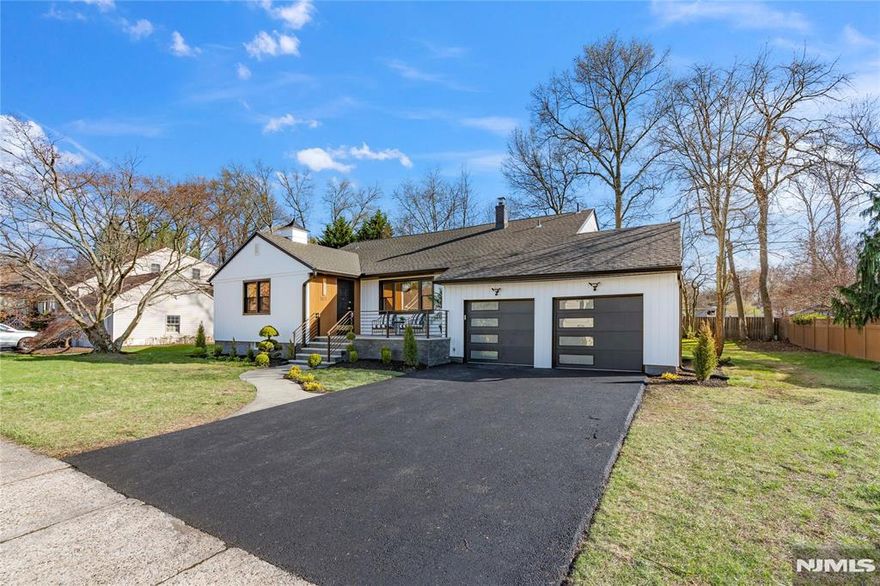 Welcome to this one-of-a-kind, handcrafted custom home, perfectly situated in the most desirable part of Emerson near the Golf Club! Offering 4 floors of beautifully finished living space ,including a recreation room. This 5-bedroom, 3-bath stunner combines custom craftsmanship with modern luxury. Step inside to an open, sun-drenched layout featuring soaring vaulted ceilings, custom woodwork, a sleek fireplace with built-in shelving, and gleaming hardwood floors with detailed crown molding throughout. The gourmet kitchen is a showstopper with stainless steel appliances, quartz countertops, a striking herringbone tile backsplash, and a sage green island topped with black velvet barstools , all flowing seamlessly into a bright dining area crowned by a crystal chandelier. A spacious family room offers the perfect place to relax, entertain, or gather with loved ones. Surrounded by lush greenery, this exceptional home delivers suburban tranquility while being minutes from top schools, parks, shopping, dining, and highways. 185 Colonial Rd is the rare opportunity youâ€™ve been waiting for â€” luxury, space, and style all in one. Donâ€™t miss this opportunity to own your dream home!