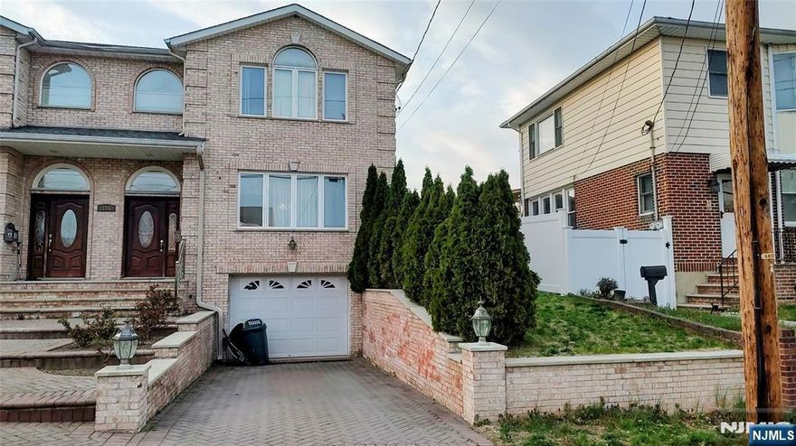 Spacious and modern 3-bedroom and 3.5 bathroom half duplex in a great location in Elmwood Park. First floor offers: a large living room/dining room combo, an eat-in kitchen with granite countertops, stainless steel appliances, and maple wood cabinets. A pantry, a half bathroom, and a sliding door with direct access to the patio. The second floor contains a large master bedroom with a vaulted ceiling, 2 walk-in closets, and master bathroom, plus 2 other large bedrooms with wall-to-wall closets and a full bathroom. The ground level is finished with a family room, full bathroom, laundry room, and access to the garage. Additional features: hardwood floors, recessed lights, central air, and central vacuum, stainless steel appliances, granite countertops, and granite finished 3 full and 1 half bathrooms, private and fenced in yard, driveway, and garage.