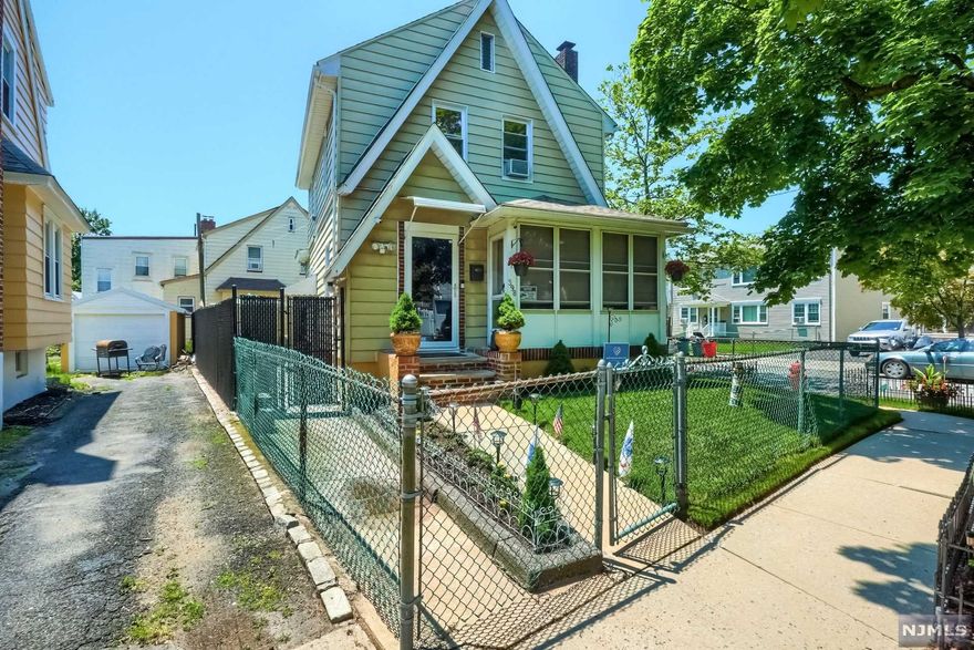 Enjoy the enclosed porch as you enter this very well kept home with spacious living and dining room, hardwood floors, wood burning fireplace, eat-in kitchen and powder room round out the first floor. Second floor boosts 3 nice size bedrooms and full bath. Enjoy additional living space with two enclosed porches and a fully fenced yard. The newly finished basement offers options for rec room or home office. Additionally,, this home features updated 2nd floor windows, storms on the first floor, sprinkler systems and alarm system with cameras and a one car garage. Homeowner's flood insurance is currently only $942/yr. You don't want to miss this fantastic home!