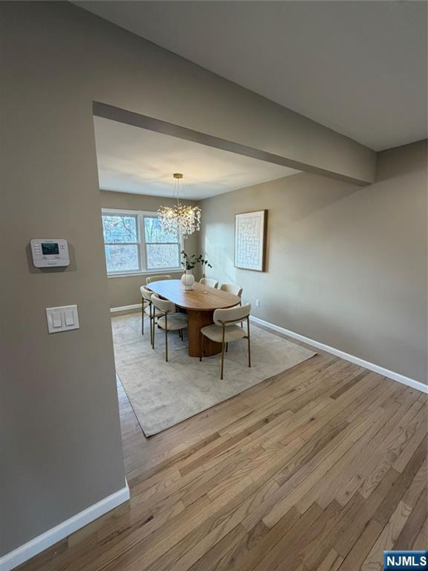 This beautifully renovated raised ranch features 3 bedrooms and 2 full bathrooms. The open kitchen and appliances are all new, with quartz countertops and a herringbone tile backsplash. The oak hardwood flooring adds a touch of elegance, while the spacious 4-season sunroom serves as a family room. The living room is filled with natural light from a large picture window, and a separate TV game room provides entertainment for the whole family. Thereâ€™s also a one-car garage with storage, and the large backyard offers ample space for a pool. The new HVAC system includes central air and gas forced-air heat, ensuring a comfortable living environment. This warm neighborhood is conveniently located near schools, making it an ideal place to call home!