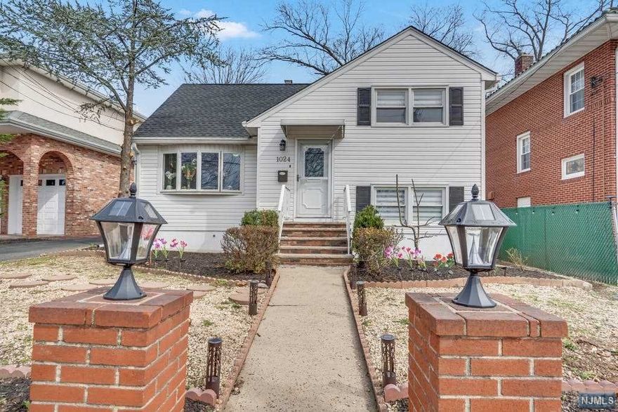 This spacious tri-level home, set on a quiet street, offers an open floor plan with 3 bedrooms, plus a bonus den which could be a 4th bedroom, and 2 full baths. Enter the bright living room which opens to a gorgeous granite, eat-in kitchen with beautiful white cabinets, tile floor and backsplash and stainless-steel appliances. The 2nd floor features 2 bedrooms and a full bath. There is a 3rd level with a spacious primary bedroom with walk-in closet and skylight. The family room offers access to the patio and back yard. On the lower level you will find a recreation room, laundry room and a full bath. 2 zone heating, updated windows, 2 car detached garage and conveniently located close to NYC transit, major highways and vibrant shopping area.