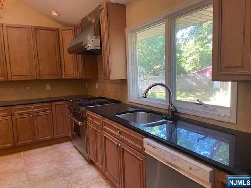 Great opportunity to renovate or update! 3 bedroom, 2.5 bath expanded ranch being sold in as is condition. Large kitchen with center island. Hardwood floors throughout. First floor has 2 bedrooms, full bath. Second floor offers large bedroom with private bathroom, walk in closet. Additional office space. Two car garage, large yard. 2nd floor central air not functioning. Woodcliff Lake offers top rated schools and easy commute with bus or train!