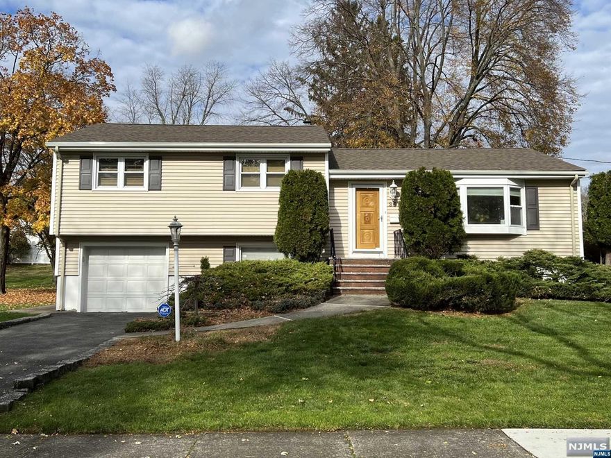 4 Bedroom Split Level home in Valley Section. Renovated Kitchen w/Stainless Appliances. Hardwood Floors thru-out. Master Bedroom has full Bath, Main Bath w/Dual Sinks & Skylight. Finished Lower Level boasts Bar Area, Bedroom, Full Bath & Laundry Area, Family Room walk out to Brand New Patio, Large Level Yard. Walking distance to Schools, Shopping, Houses of Worship and Transportation.