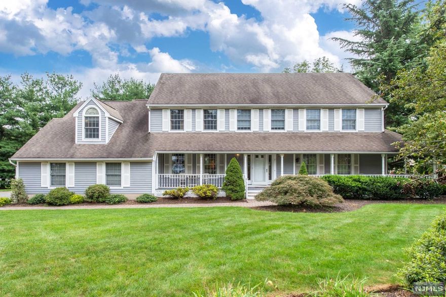 Welcome to this quintessential center hall colonial gem greeting you with an inviting wrap around lemonade porch overlooking an expansive, level property on a tucked away, tree-lined cul-de-sac street. The sunlit foyer shows the perfect symmetry opening to the formal living room & dining room. The formal living room has gorgeous French doors that allows porch access. Cozy family room offers a Carian Marble facia fireplace matched with reclaimed hardwood accent wall. Elegant gourmet kitchen is wonderful for entertaining with a generous sized center island, granite countertops, high end stainless steel appliances & an open concept layout. Primary bedroom offers soaking tub & stall shower, walk-in closet & huge loft sitting room that opens to the downstairs office/den. Upstairs bedrooms are spacious with a great deal of closet space. Basement has a full recreation room, exercise area, full bath & game room area. Backyard has paver patio, fire pit area, deck & tons of yard space.