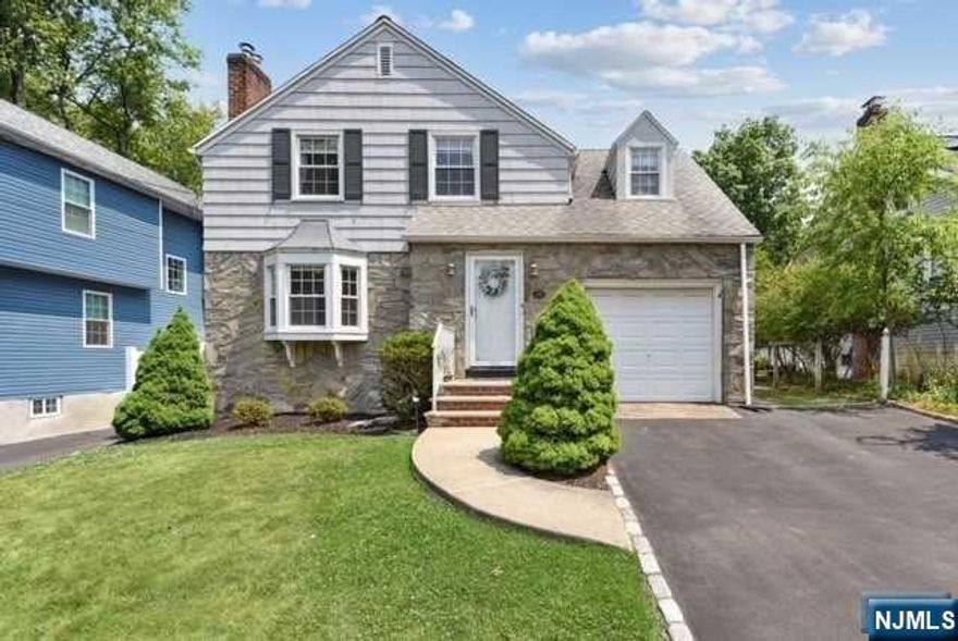 Dreaming of a picture perfect 3 Bed, 2 Bath Colonial w/ young & fresh decor, look no further! Features great curb appeal & a perfect backyard for summer fun! Steps to NYC bus, shopping & restaurants. Upon entry, the wood style floors & crown molding in the Living Room & Dining Room is sure to please. The wood burning Fireplace (w/insert) in the Living Room is a stunning focal point 2/ a custom Hearth & built in shelving. The gourmet Kitchen features off-white cabinetry, SS appliances, tile backsplash, granite countertops, breakfast bar, sun-drenched breakfast area or versatile Family Room has an additional coffee bar w/ cabinet storage and French Doors leading out to a newly painted deck. Second level w/ 3 spacious Bedrooms, updated Full Bath and multiple Closets. The finished Basement is cozy & provides a Recreation Space, Exercise Room, a Full Bathroom w/ stall shower, Laundry Room w/ storage and utilities. (Addt'l upgrades include: newer central air, hot water heater and more)